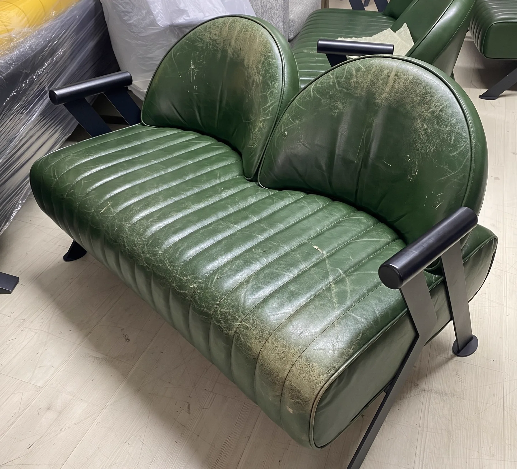 Dull, dry tan leather sofa before restoration